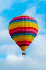 Wall Mural - Bright air balloon in blue sky