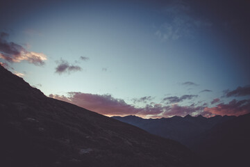 Wall Mural - Sunset on the mountains at the Switzerland Italian border towards the Engadina region. Vallelunga, Alto Adige, Italy