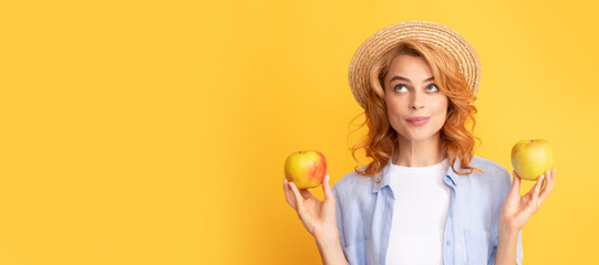 Summer apple. Woman isolated face portrait, banner with mock up copy space. woman in straw hat eating healthy food. youth health. natural organic fresh apple.