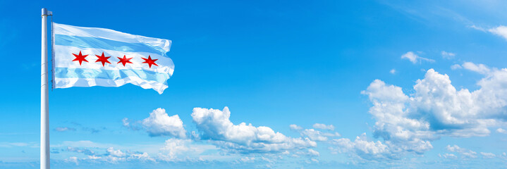 Wall Mural - Chicago - USA, flag waving on a blue sky in beautiful clouds - Horizontal banner