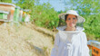 © Iván Moreno - Portrait of a female beekeeper in a field