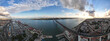 Aerial panoramic view of 25 de Abril bridge over the Tagus River at sunset in Lisbon, Portugal.