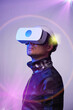 © nuclear_lily - Man is using virtual reality headset. Concept of virtual, augmented and extended reality and metaverse.