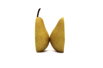 Wall Mural - Two halves of a pear stand on a white isolated background.