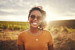Happy, black woman and summer travel happiness of a person in nature. Portrait of a person from Texas with a smile feeling holiday freedom from traveling in the countryside on vacation break