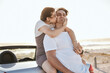 © S Fanti/peopleimages.com - Couple, beach and kiss for love, travel vacation relaxing together on a road trip in Costa Rica. Woman kissing her man in happy romance for relax traveling and real relationship in the outdoors