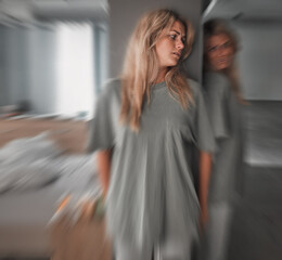 Wall Mural - Bipolar, depression and scared young woman in a bedroom with worry, fear and stress. Insomnia, mental health problem and patient in pain with blur motion, anxiety and schizophrenia at mental hospital