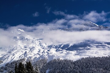 Sticker - Closeup of a snowy Alps mountain peak on a sunny day in lenzerheide, Switzerland