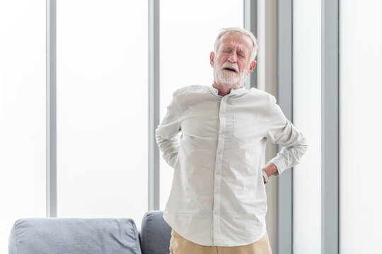 Fototapete - Senior man with back pain. Mature man suffering from low back pain. Old man with back pain