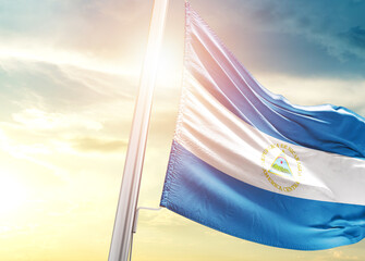 Wall Mural - Nicaragua national flag cloth fabric waving on the beautiful sunlight - Image