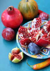 Poster - Colorful still life with fresh fruit. Pomegranate close up photo. Israeli food on a table. Eating fresh concept. 