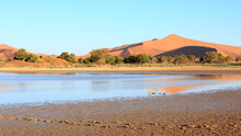 Namib Desert, Tsauchab River Which Filled And Flooded Sossusvlei In March 2022, A Salt And Clay Pan Surrounded By Red Sand Dunes. This Astounding Occurrence Hasn’t Been Seen For A Decade.