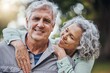 © Clement Coetzee/peopleimages.com - Senior hug, couple and marriage love in nature with a happy smile of people. Happiness of a elderly woman and man portrait together enjoying retirement, romance and quality time smiling outdoor