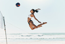 Sports Woman Jump At Volleyball Beach Summer Outdoor Competition Game On Ocean Or Sea Sand Playing To Win. Healthy, Fitness And Training Agile Girl Or Young Athlete Ready Hit Ball Over Net In Match