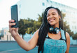© N Lawrenson/peopleimages.com - Happy young black woman in city, selfie video call on smartphone and New York wifi 5g connection. Digital technology, african girl smile on street and online mobile ux in cool urban lifestyle