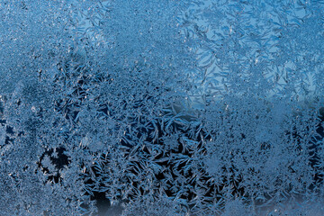 Poster - Frosty winter background photo of ice buildup on a window.