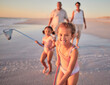 Children, fishing and family with a girl at the beach with her grandparents and sister for summer holiday. Kids, happy and ocean with a child on sand by the sea with her grandmother and grandfather