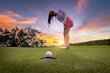 Professional woman golfer teeing golf in golf tournament competition at golf course for winner.	