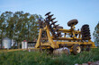 Agricultural machinery, disc harrow in a field
