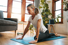 Woman, Yoga And Pigeon Pose Stretching In House Or Home Living Room For Relax Exercise, Training And Workout In Germany Lockdown. Zen, Calm And Mature Peace Yogi In Mind Wellness And Fitness For Hips