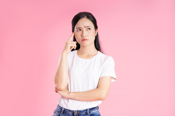 beautiful asian girl portrait, isolated on pink background