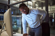 © N Lawrenson/peopleimages.com - Stress at night, tired employee with back pain working at night and risk of burnout or quitting. Career dedication, marketing professional with deadline and motivation to complete project for success