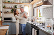 © N Lawrenson/peopleimages.com - Couple, dance and kitchen with a senior woman and man dancing while happy together in their home. Retirement, smile and love with elderly pensioners being romantic in a house in the morning