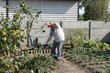 © Aliaksei Luskin - man working in the garden