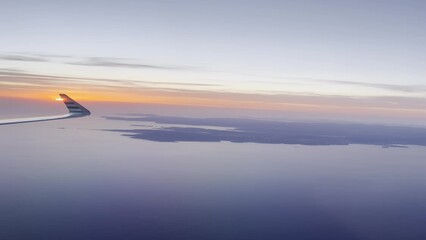 Poster - Aerial vertical view of the soft sunset from the airplane