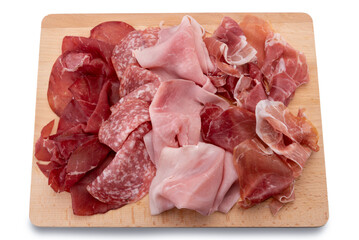 Poster - Cold cuts sliced on wooden cutting board, slices of bresaola, salami, ham and Parma ham, isolated on white