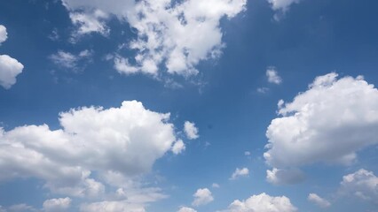 Wall Mural - time lapse of white clouds in blue sky