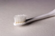 Closeup old toothbrush on white background. Toothbrush's bristles are worn out.