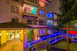 Modern apartment building with beautiful Christmas decoration at winter at night in Vancouver, Canada, North America. Night time on December 2021.