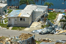 Destroyed By Hurricane Ian Suburban House In Florida Mobile Home Residential Area. Consequences Of Natural Disaster