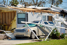 Severely Damaged By Hurricane Ian House And Vehicle In Florida Mobile Home Residential Area. Consequences Of Natural Disaster