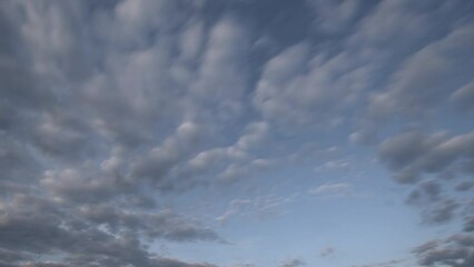 Wall Mural - white clouds float across the blue sky timelapse