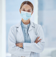 Wall Mural - Woman, healthcare and covid face, mask rules with proud doctor working in a hospital, ready and confident. Health care professional leader work during pandemic, focused on helping sick people