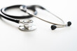 © aijiro - 白テーブルの上に置かれた聴診器　医療イメージ