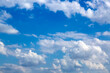 Fantastic soft white clouds against blue sky background, soft focus lens flare sunlight. Sunshine clouds sky during morning background. Abstract blurred gradient of peaceful nature. View out windows