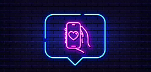 Wall Mural - Neon light speech bubble. Dating app line icon. Hand hold phone sign. Cellphone with screen notification symbol. Neon light background. Dating app glow line. Brick wall banner. Vector