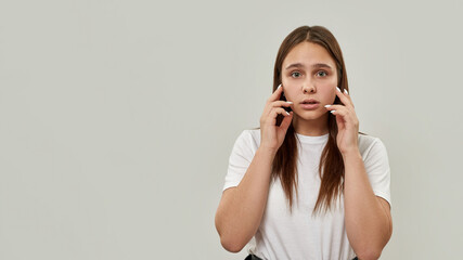 Wall Mural - Tense caucasian female teenage looking at camera