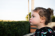 © Austockphoto - Toddler pulling a silly face outdoors