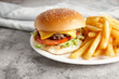 © Austockphoto - classic beef burger with fenchfries on the side