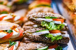© monticellllo - Freshly prepared sandwiches sold in a fast food restaurant