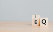 EQ to IQ filpping which word on wooden cube block. Smart idea and creative concept.