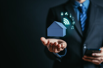 Poster - Smart home with icon technology eco-system wireless control internet network concept. Businessman holding house model 3D.