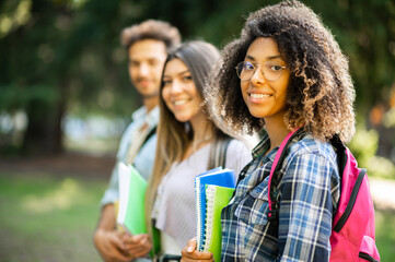 Happy multiethnic group of students smiling outdoor