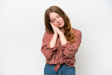 Young pretty woman isolated on white background making sleep gesture in dorable expression