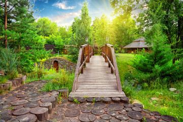 Wall Mural - wooden decorative bridge in the estate with landscaping in day