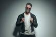 © Viorel Sima - casual man pulling his leather jacket, wearing sunglasses